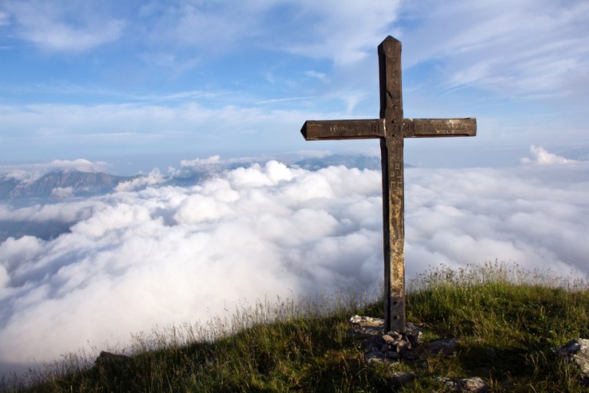 Summit Cross above clouds